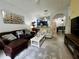 Cozy living room area leading to a dining and kitchen area with stainless steel appliances at 1106 Gran Bahama Blvd # 1106, Davenport, FL 33897