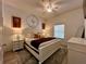 Comfortable main bedroom featuring a decorative clock, ceiling fan, and bright natural light at 1106 Gran Bahama Blvd # 1106, Davenport, FL 33897