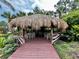 Inviting tiki hut dining area surrounded by lush landscaping at 1106 Gran Bahama Blvd # 1106, Davenport, FL 33897