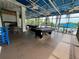Spacious shaded patio featuring pool tables, providing an excellent space for outdoor activities and recreation at 1106 Gran Bahama Blvd # 1106, Davenport, FL 33897