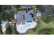 Aerial view of the pool area with plenty of lounge chairs and a hot tub nearby at 1106 Gran Bahama Blvd # 1106, Davenport, FL 33897