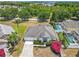 Aerial view of a well-maintained home featuring lush landscaping and a peaceful setting at 116 Westport Ln, Davenport, FL 33896
