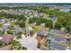 Aerial view of the home surrounded by lush landscapes, tranquil pond, and inviting neighborhood at 116 Westport Ln, Davenport, FL 33896