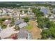 Expansive aerial view showcasing the neighborhood's ponds and the property with a screened-in pool at 116 Westport Ln, Davenport, FL 33896