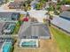 Aerial view showcases the backyard pool and the layout within the community at 116 Westport Ln, Davenport, FL 33896