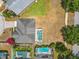 Aerial view of the home and screened-in pool within a tranquil backyard setting at 116 Westport Ln, Davenport, FL 33896