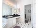 Bathroom boasts a vanity, large mirror, and glass-enclosed shower at 116 Westport Ln, Davenport, FL 33896