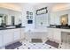 Bright bathroom features dual sinks, soaking tub, and black and white tile at 116 Westport Ln, Davenport, FL 33896