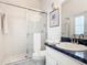 Bathroom boasts a glass-enclosed shower, vanity, and toilet at 116 Westport Ln, Davenport, FL 33896