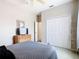 Bedroom with a TV, closet, and dresser at 116 Westport Ln, Davenport, FL 33896
