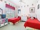 Bedroom featuring two twin beds and Disney themed decor at 116 Westport Ln, Davenport, FL 33896