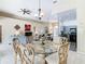 Open-concept living space with dining room, kitchen, and a view to the living room at 116 Westport Ln, Davenport, FL 33896