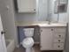 Half bathroom features white vanity, tile flooring, and toilet at 1325 Lake Shadow Cir # 12205, Maitland, FL 32751