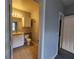 A well-lit bathroom featuring a vanity with storage, a toilet, and tile flooring at 1325 Lake Shadow Cir # 12205, Maitland, FL 32751