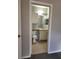 View into a half bathroom featuring tile flooring, vanity, and toilet at 1325 Lake Shadow Cir # 12205, Maitland, FL 32751