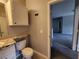 A half bathroom featuring a vanity with storage, a toilet at 1325 Lake Shadow Cir # 12205, Maitland, FL 32751
