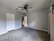 Bedroom with neutral gray carpet, white trim, and a ceiling fan at 1325 Lake Shadow Cir # 12205, Maitland, FL 32751