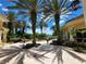 Exterior courtyard with palm trees and a water feature at an apartment complex at 1325 Lake Shadow Cir # 12205, Maitland, FL 32751