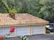 Outdoor view of garage with parking spot for residents with tiled roof at 1325 Lake Shadow Cir # 12205, Maitland, FL 32751