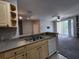 Open concept kitchen with view to living room and balcony access at 1325 Lake Shadow Cir # 12205, Maitland, FL 32751