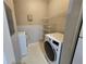 Laundry room with washer, dryer, and shelving at 1325 Lake Shadow Cir # 12205, Maitland, FL 32751