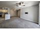 Spacious living room features modern ceiling fan, neutral paint, and gray carpet throughout at 1325 Lake Shadow Cir # 12205, Maitland, FL 32751