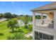 Relaxing balcony with a ceiling fan overlooking the peaceful lake, providing a great view at 16072 Shasta St, Clermont, FL 34714