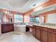 Open bathroom with tile floors, dual sinks, and tub at 16072 Shasta St, Clermont, FL 34714