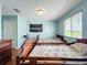 Bedroom featuring two beds, a dresser, light blue walls, and one window at 16072 Shasta St, Clermont, FL 34714