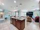 Bright kitchen featuring an island with granite countertops, stainless steel appliances, and eat in area at 16072 Shasta St, Clermont, FL 34714