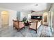 Living room with large fish tank, seating, and decorative archways add architectural interest at 16072 Shasta St, Clermont, FL 34714