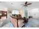 Open living space features couches, and dining room visible through arched doorway at 16072 Shasta St, Clermont, FL 34714