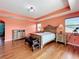 The main bedroom features a tray ceiling, two night stands, a bench at the foot of the bed, and a telescope at 16072 Shasta St, Clermont, FL 34714