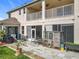 Spacious patio with chairs, an outdoor kitchen area, and a chicken coop, perfect for outdoor living at 16072 Shasta St, Clermont, FL 34714