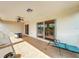 Covered patio with ceiling fans, sliding glass doors, and tile flooring, perfect for outdoor entertaining at 16072 Shasta St, Clermont, FL 34714