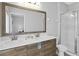 Elegant bathroom featuring a double vanity and glass enclosed shower at 163 Kenny Blvd, Haines City, FL 33844