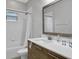 Bathroom featuring a modern vanity with neutral colors, bright light and a tub and shower at 163 Kenny Blvd, Haines City, FL 33844