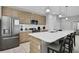Modern kitchen with stainless steel appliances, a large island and stylish light fixtures at 163 Kenny Blvd, Haines City, FL 33844