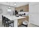 Modern kitchen features quartz counters, stainless steel appliances, and eat in bar at 163 Kenny Blvd, Haines City, FL 33844
