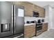 Updated kitchen featuring stainless steel appliances and sleek cabinetry at 163 Kenny Blvd, Haines City, FL 33844