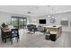 Bright open-concept living space flows into the kitchen, great for Gathering and entertaining at 163 Kenny Blvd, Haines City, FL 33844