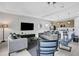 Open floor plan features living room, dining room, and kitchen with modern neutral decor at 163 Kenny Blvd, Haines City, FL 33844