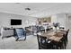Open floor plan features dining, living, and kitchen with modern neutral decor at 163 Kenny Blvd, Haines City, FL 33844