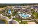 Aerial view of the community showcasing the pool, clubhouse, and scenic surroundings at 1810 Caribbean View Ter, Kissimmee, FL 34747
