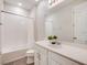 Bright bathroom features white cabinets, modern fixtures, and a shower-tub combination at 1810 Caribbean View Ter, Kissimmee, FL 34747