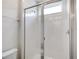 Modern bathroom featuring a sleek glass-enclosed shower with a tile surround at 1810 Caribbean View Ter, Kissimmee, FL 34747