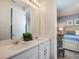 Bright bathroom with double vanity and large mirror, conveniently located next to the bedroom at 1810 Caribbean View Ter, Kissimmee, FL 34747