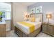 Comfortable bedroom boasts a plush bed, neutral tones, and stylish furnishings at 1810 Caribbean View Ter, Kissimmee, FL 34747