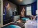 The themed bedroom features a space decor, two twin beds, and unique lighting at 1810 Caribbean View Ter, Kissimmee, FL 34747