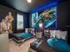 The themed bedroom features a space decor, two twin beds, and unique lighting at 1810 Caribbean View Ter, Kissimmee, FL 34747